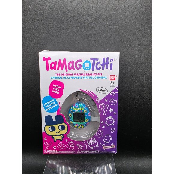 Tamagotchi Gen 1 Virtual Reality Pet - Blue With Flowers - Picture 1 of 4